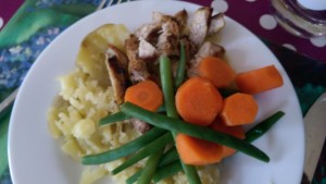 Pork, baby potatoes and carrots and green beans